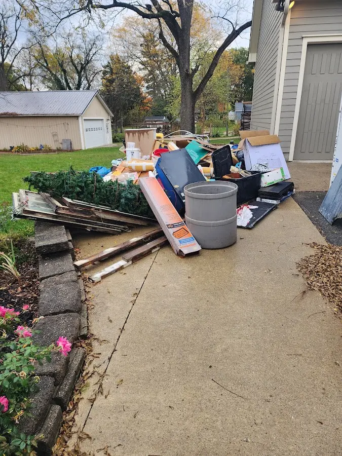 Dumpster being loaded with debris for 12 Yard Dumpster Rental in South Whittier